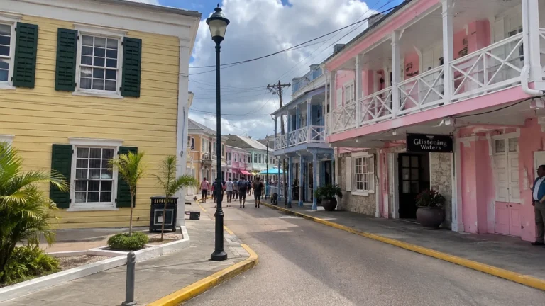 Colorful timber buildings with balconies lining a town street.