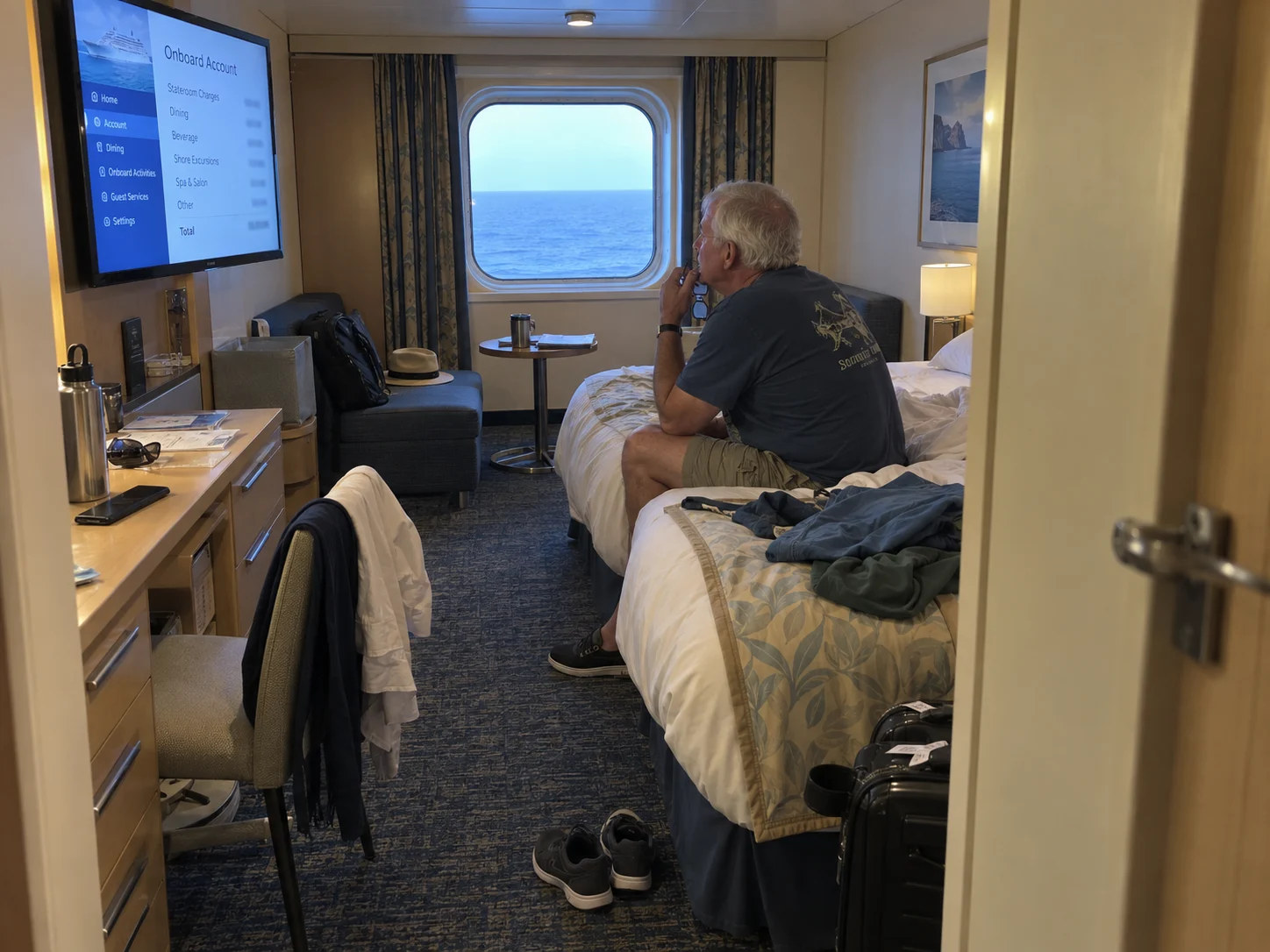 A cruiser reviews onboard charges on the cabin television.