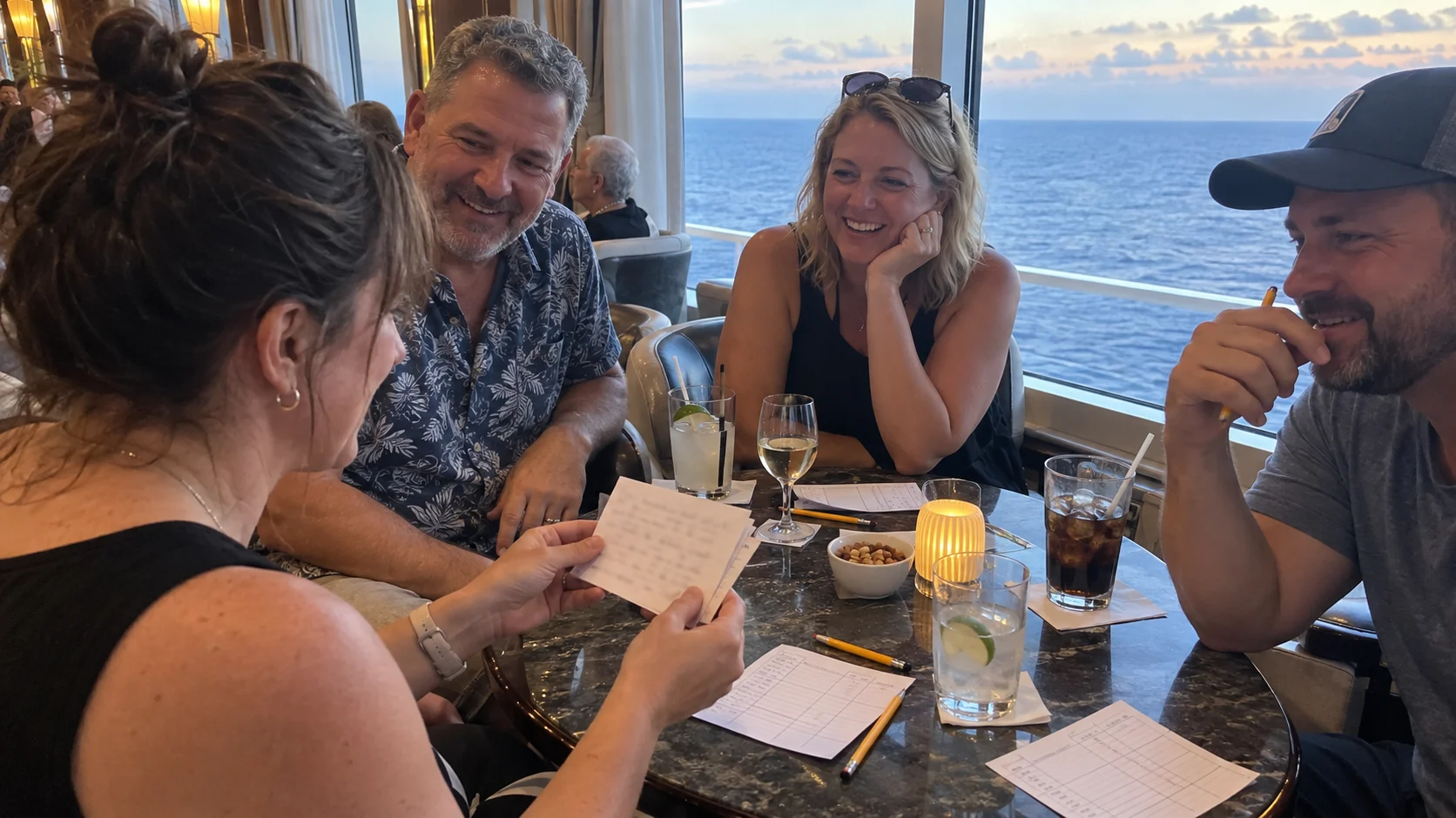 Friends playing a custom trivia quiz around a cruise lounge table overlooking the sea.