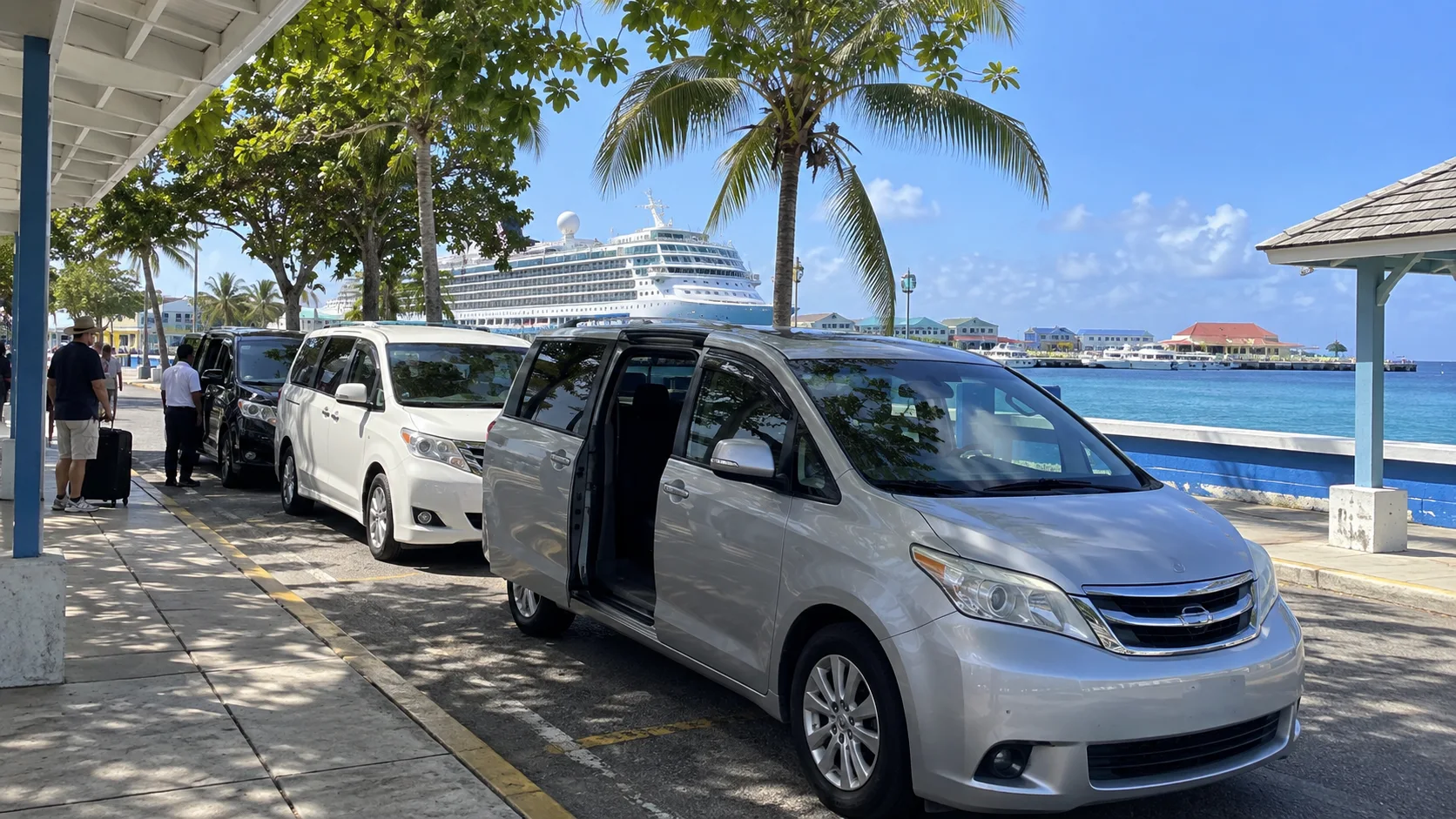 Island taxis waiting near the George Town waterfront.