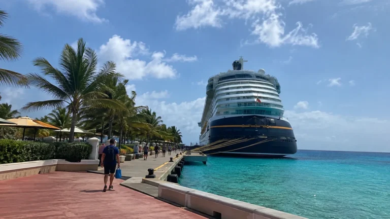 Large cruise ship docked in a turquoise tropical port