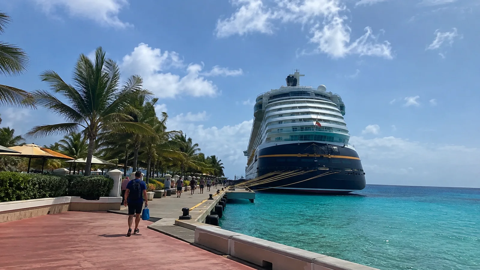 Large cruise ship docked in a turquoise tropical port