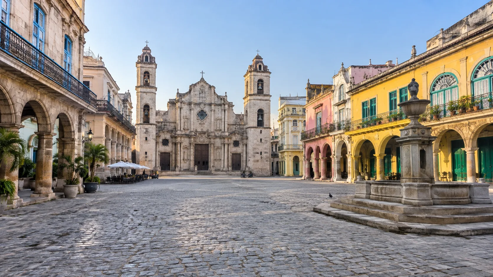 Colorful colonial buildings surrounding a historic plaza in Old Havana.