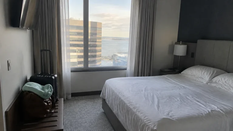 Hotel room with a double bed and window overlooking the waterfront