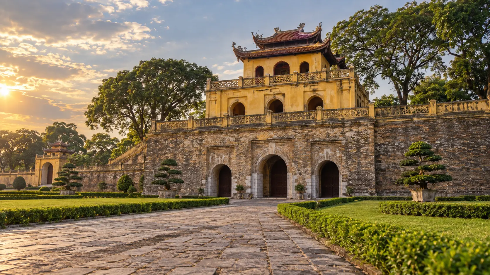 The yellow-ochre Đoan Môn gate at Hanoi's Imperial Citadel of Thang Long in late-afternoon light.