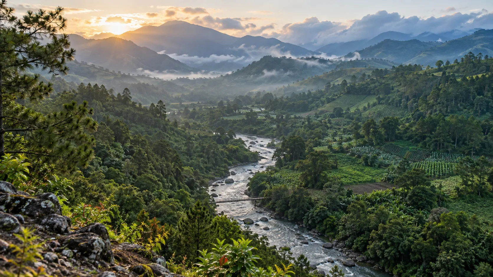 The Yaque del Norte River winding through the misty green mountains and farms of Jarabacoa.