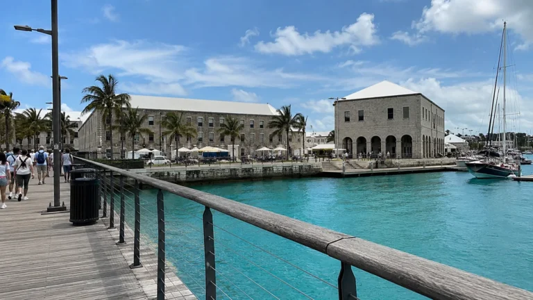 Historic waterfront buildings beside a turquoise harbor