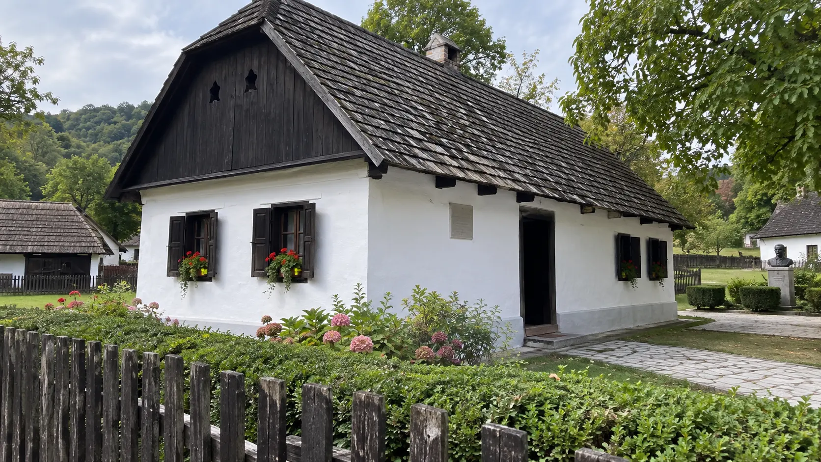 Small Saint Roch chapel above rural cottages near Kumrovec.