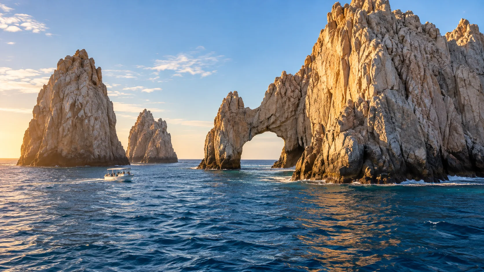 El Arco rises from blue water at Land's End in Cabo San Lucas.