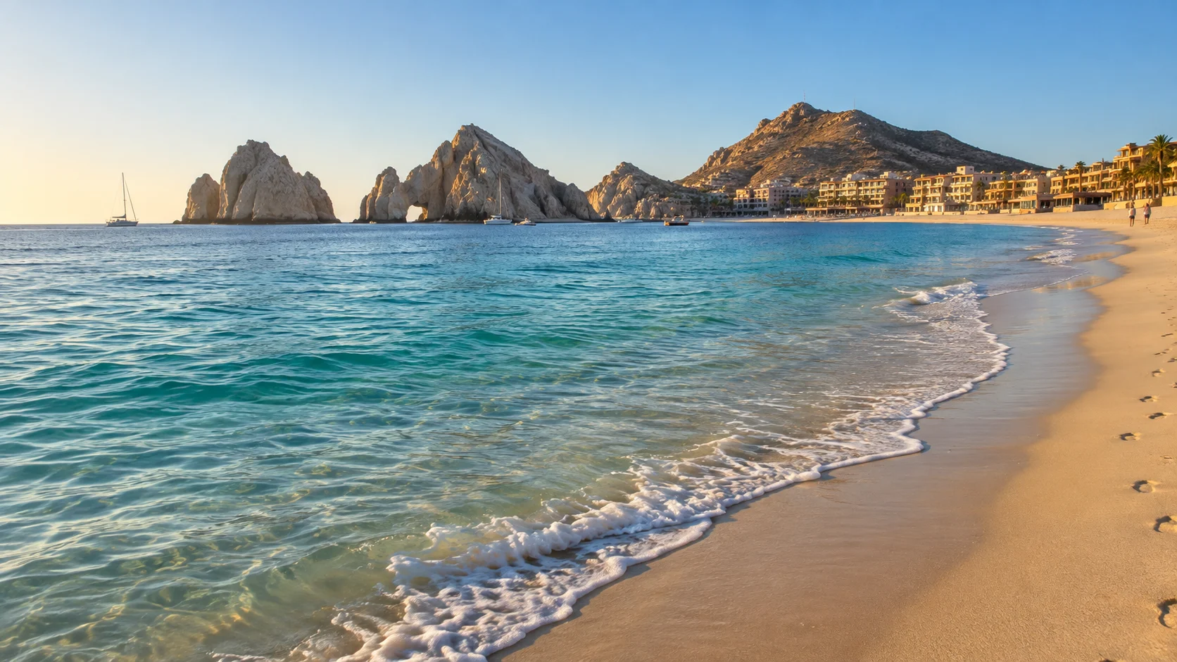 Medano Beach curves along calm water toward Cabo's rocky Land's End.