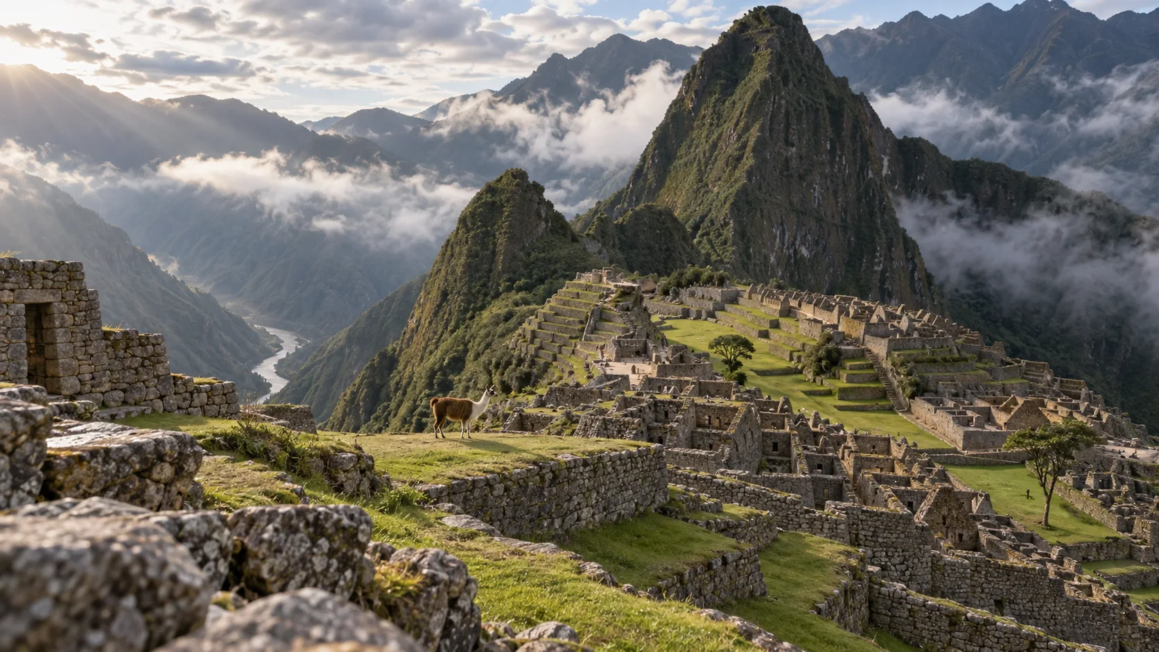 Machu Picchu terraces and Huayna Picchu emerging from morning cloud in Peru
