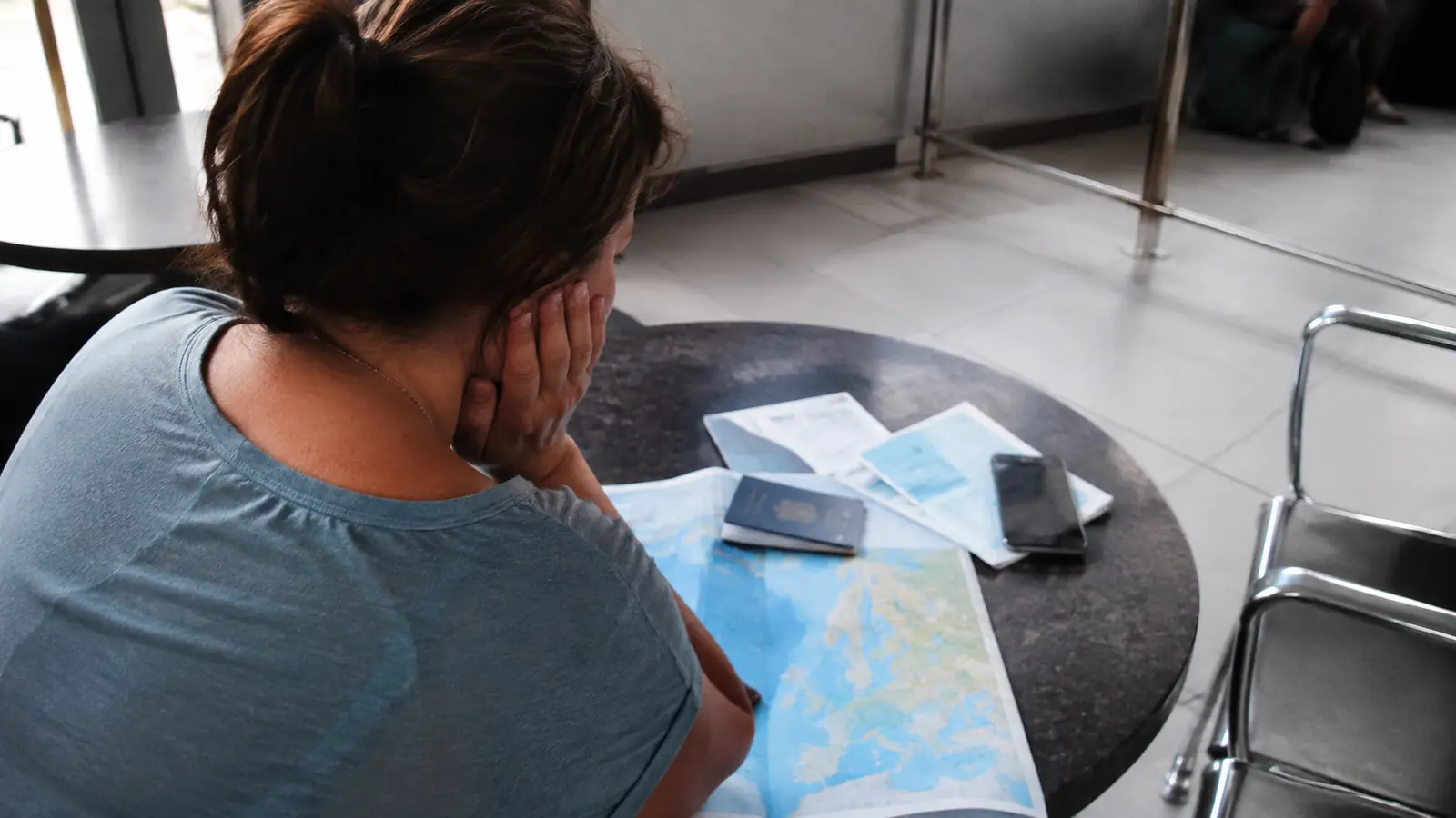 Traveler checking return-to-ship time while visiting a cruise port