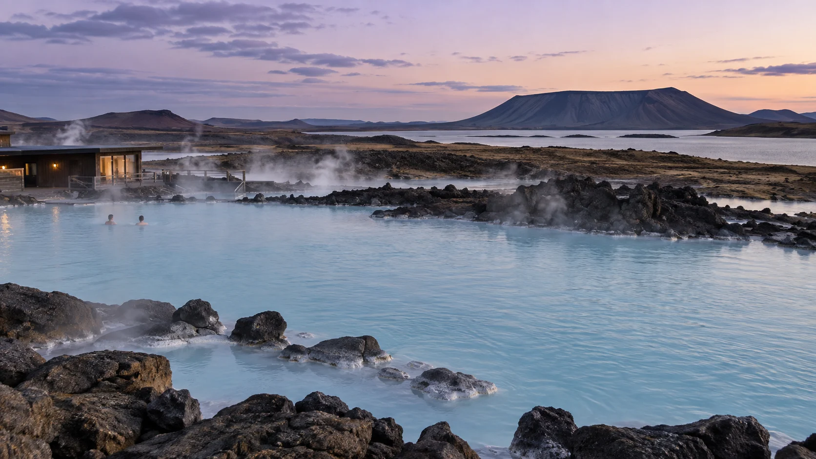Milky blue Mývatn Nature Baths beneath the dark Hverfjall crater at dusk