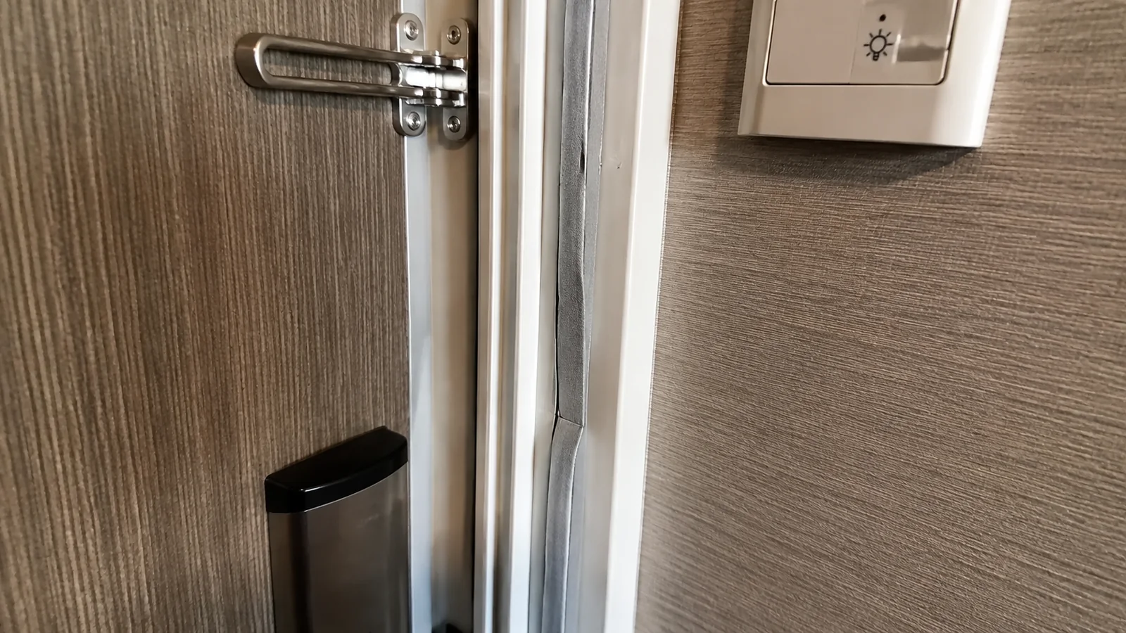 Close-up of a security latch on a cruise cabin door