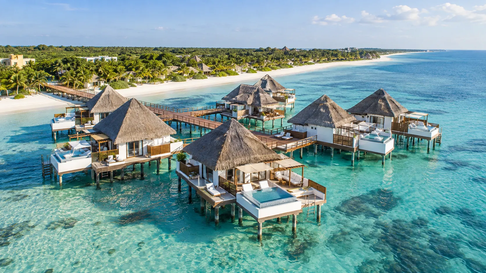 Palafitos overwater bungalows with private pools off Maroma Beach on Mexico's Riviera Maya.