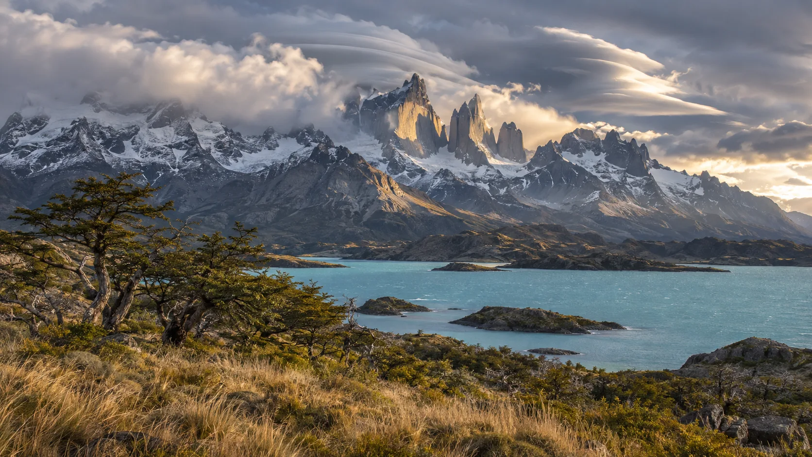 Granite towers of Torres del Paine beyond turquoise Lake Pehoé in wild Patagonian weather