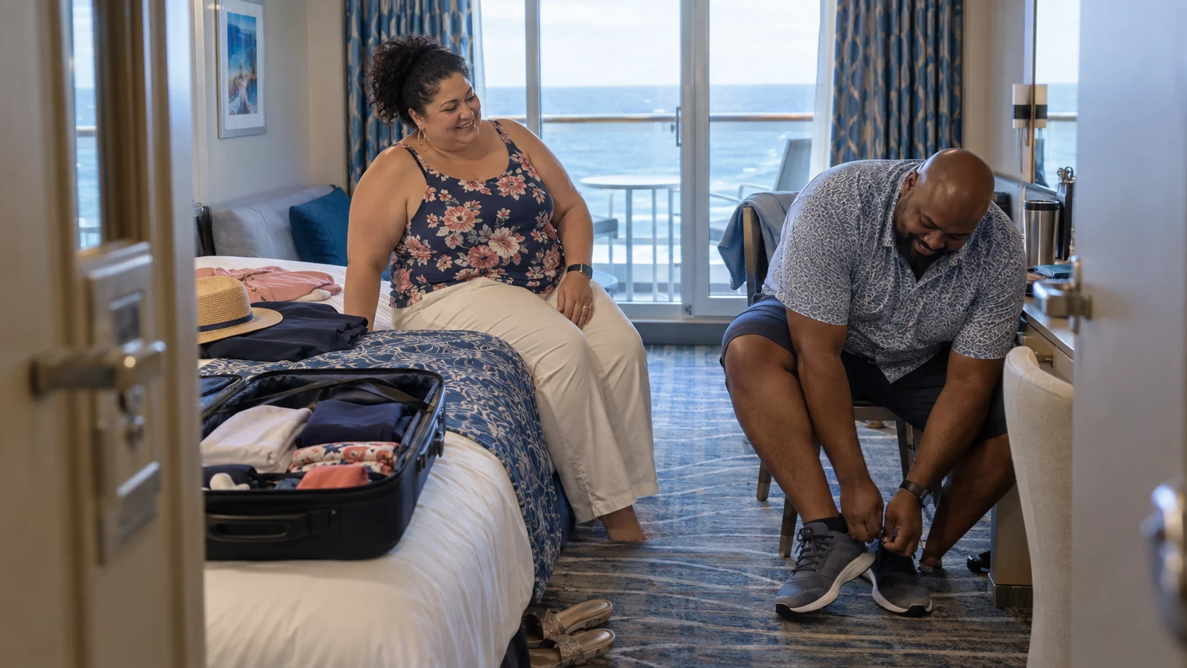 Plus-size couple testing seated comfort and tying walking shoes in a cabin