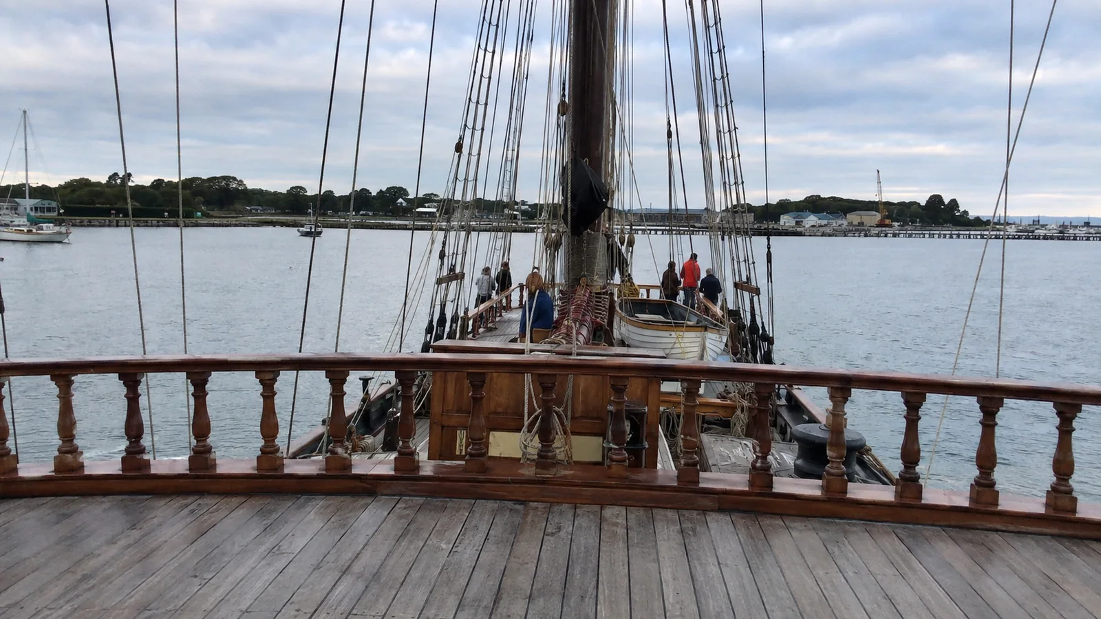 View forward from the raised stern deck of a traditional sailing ship.