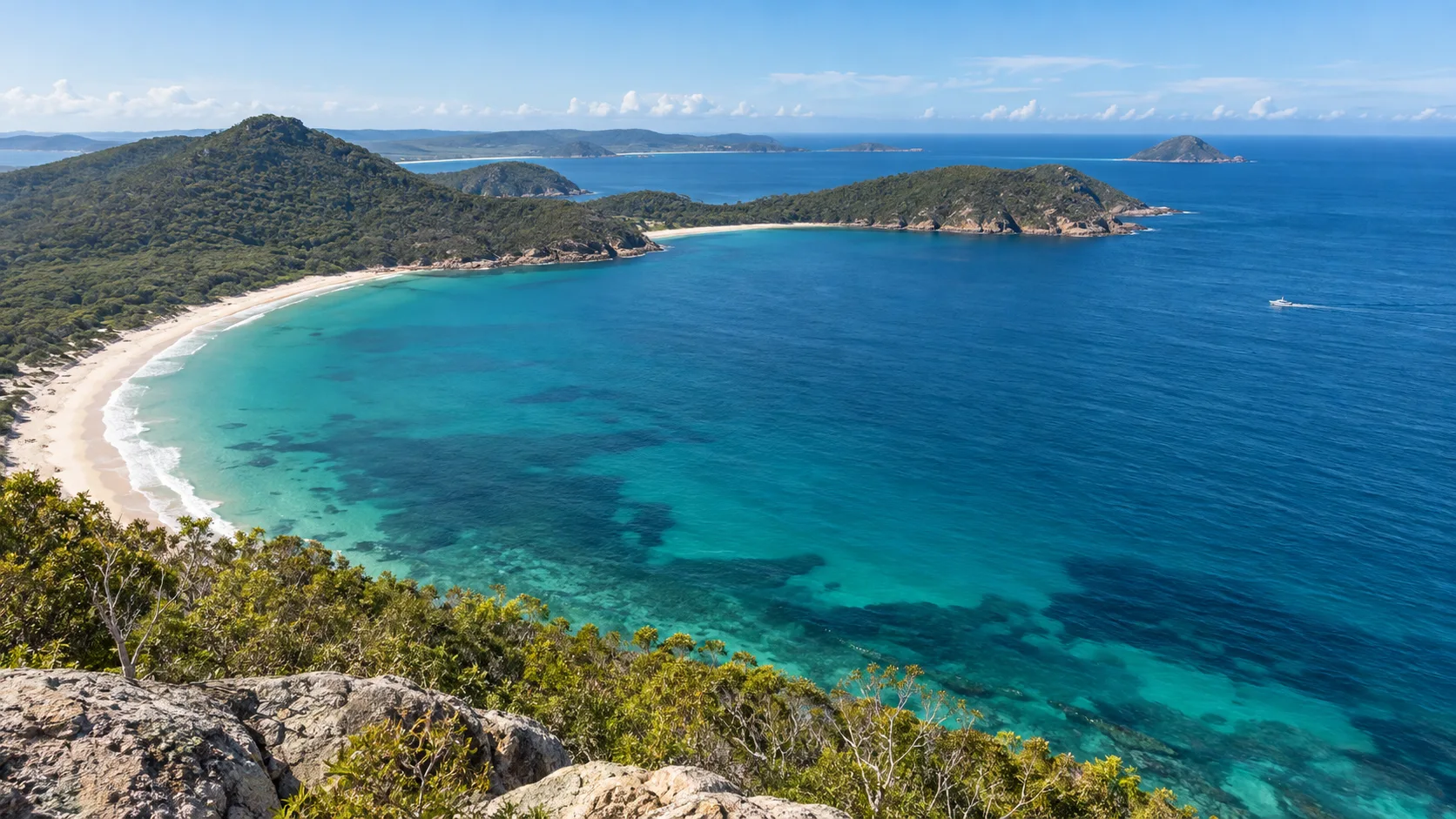 Turquoise bays and forested headlands seen from Tomaree Head near Port Stephens
