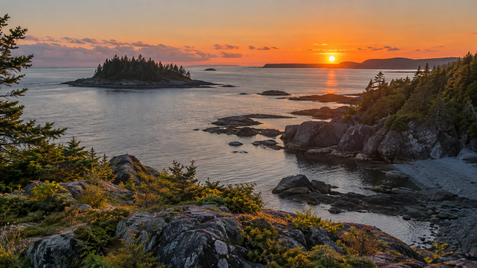 Rocky coves and small forested islands at sunset in Bic National Park.