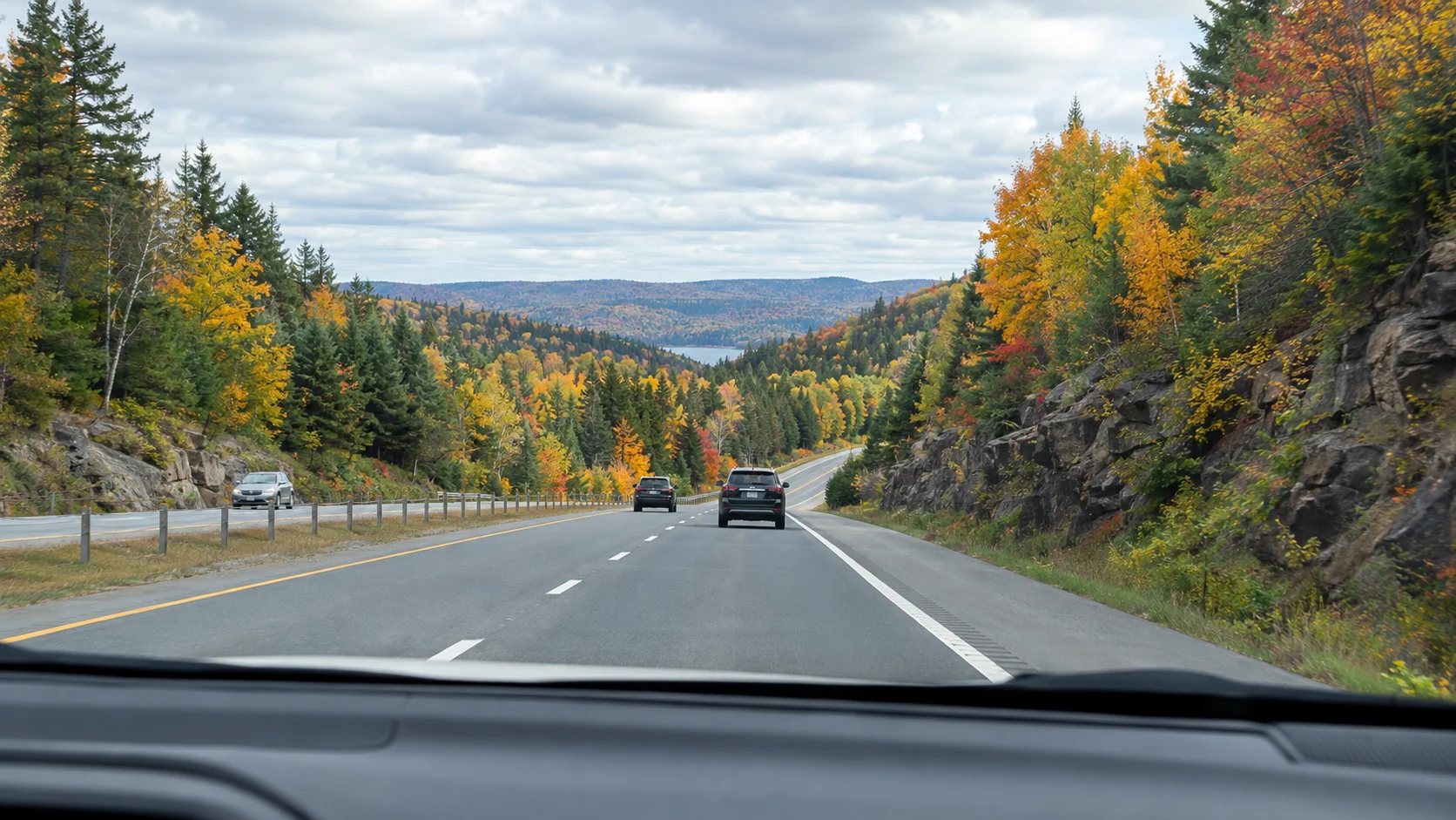Québec highway entering autumn forest on the drive from Montréal to Mauricie