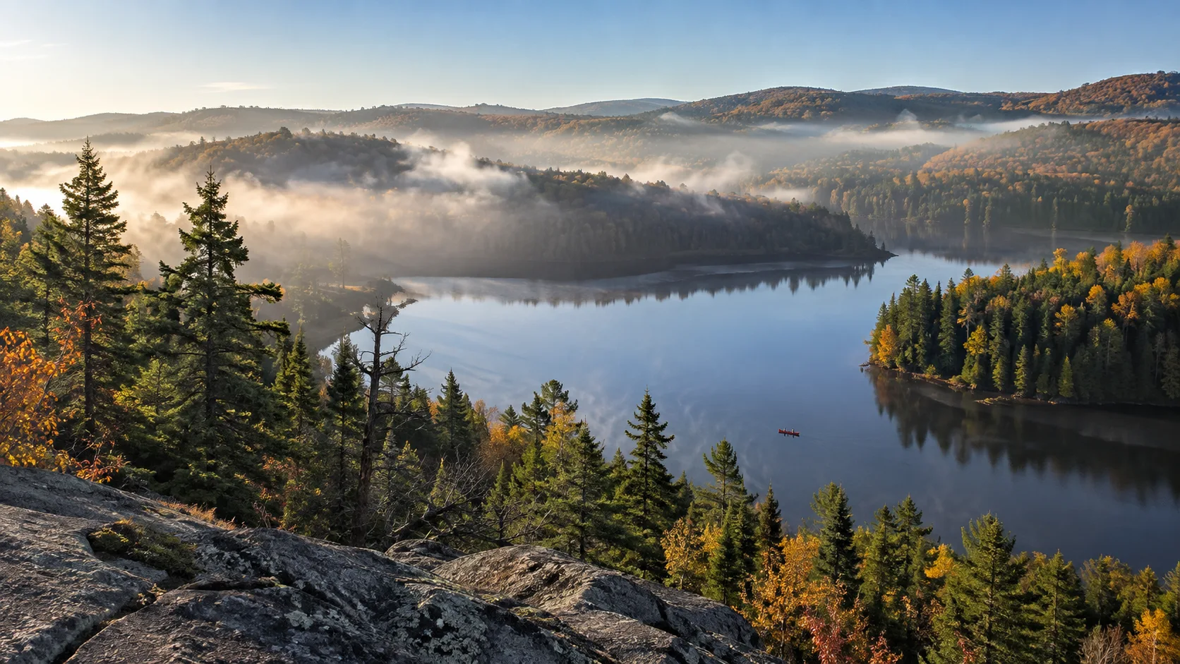 Lake, canoe, and forest viewed from a La Mauricie National Park lookout