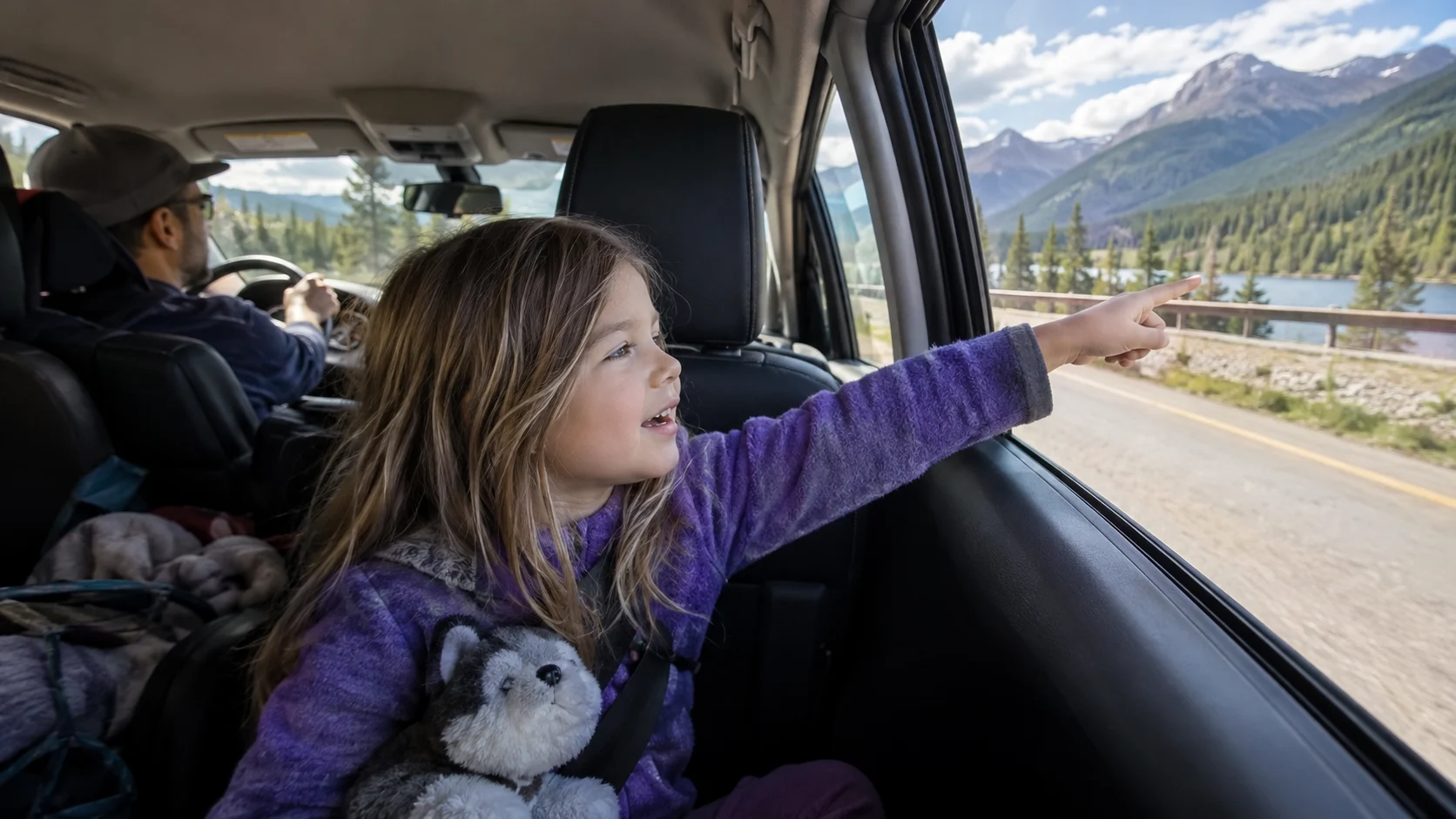 Child passenger searching roadside scenery during the Alphabet Hunt.