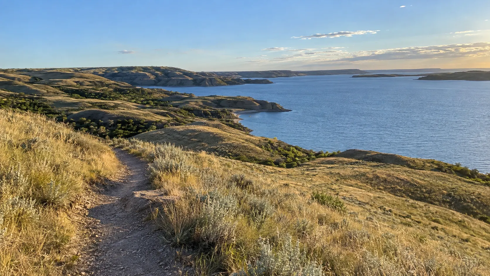 Prairie hills descending toward Lake Diefenbaker at Saskatchewan Landing.