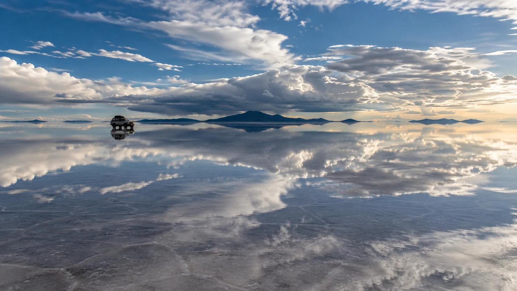 Mirror reflections across Salar de Uyuni in Bolivia