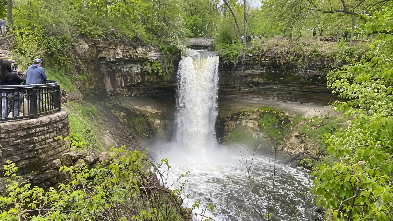 Minnehaha Falls cascading into a green gorge in Minneapolis.