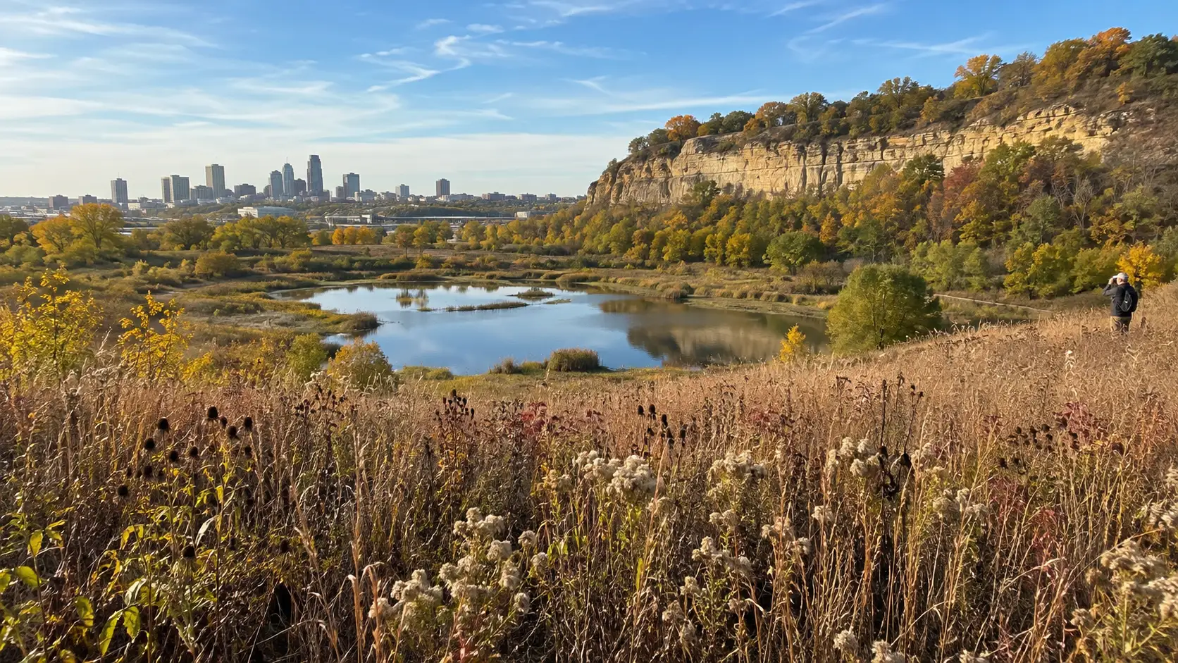 Wetland boardwalk and limestone bluffs at Bruce Vento Nature Sanctuary.