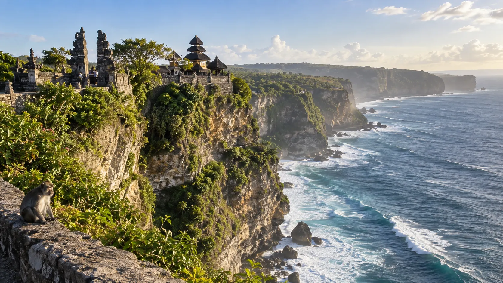 Uluwatu Temple and a macaque overlook Bali's dramatic limestone cliffs and Indian Ocean.