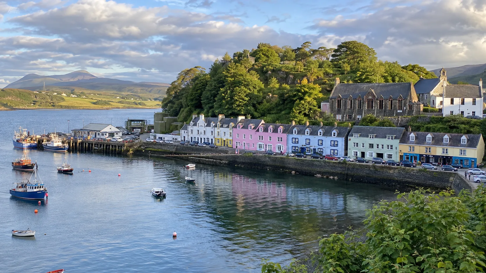 Colorful harbor houses and fishing boats in Portree on the Isle of Skye