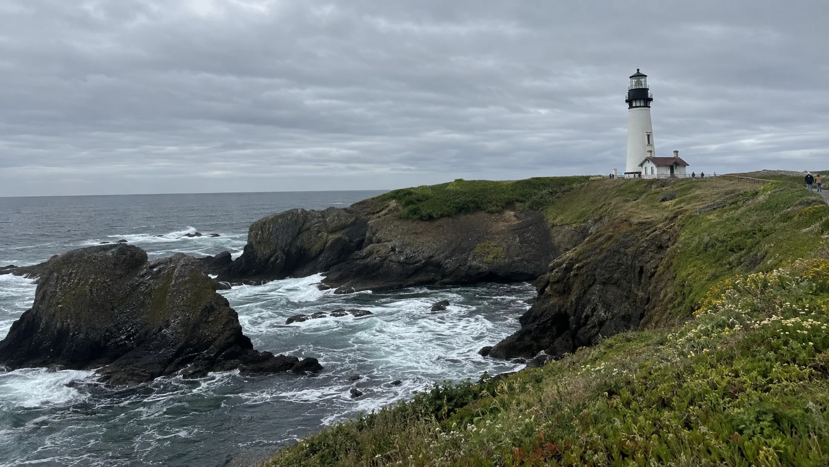 Yaquina Head Lighthouse above the rocky Pacific coast near Newport, Oregon.