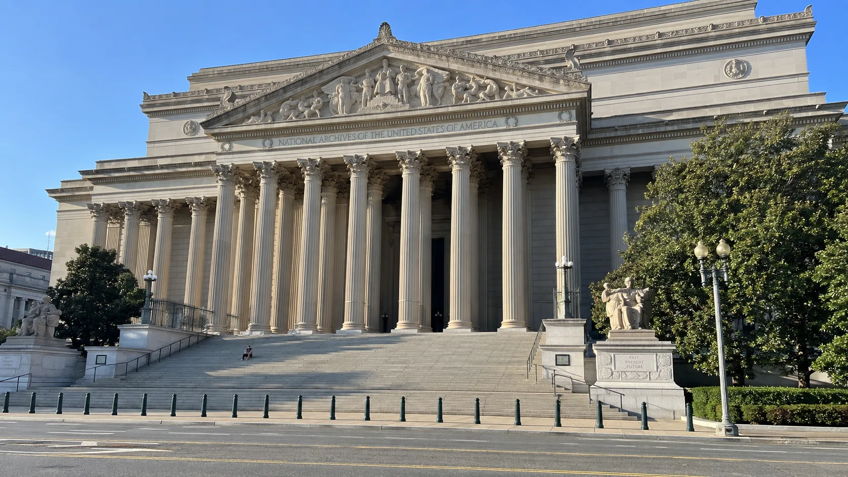 Neoclassical columns and steps of the National Archives Building in Washington, DC.