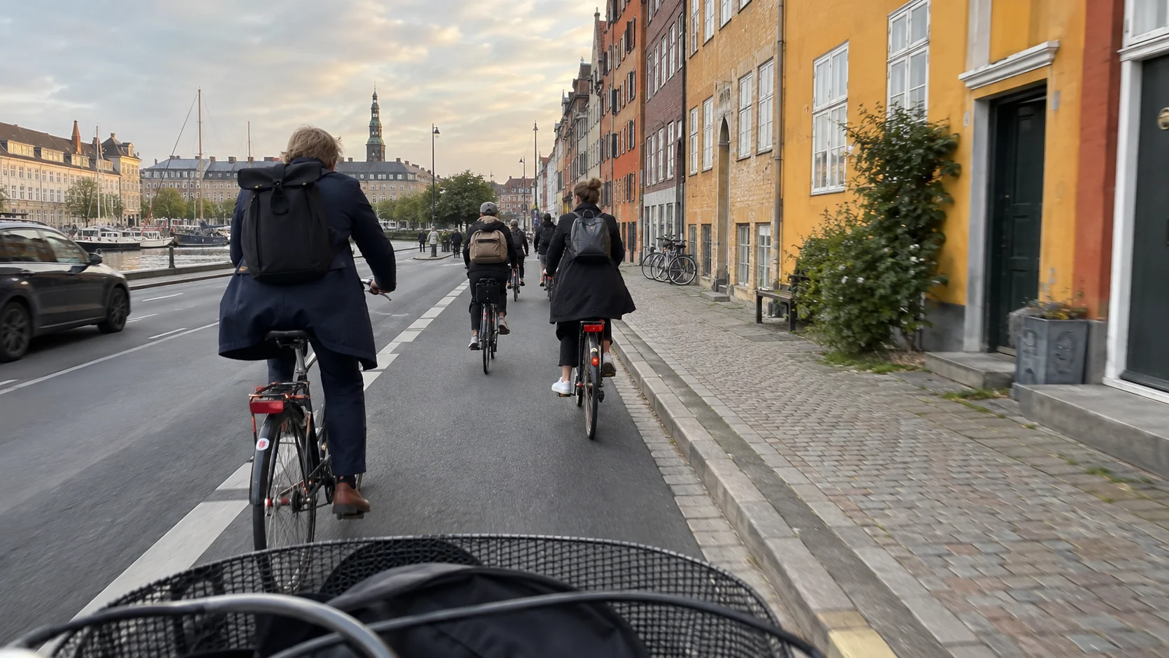 Morning bicycle commuters using a protected cycle lane in Copenhagen