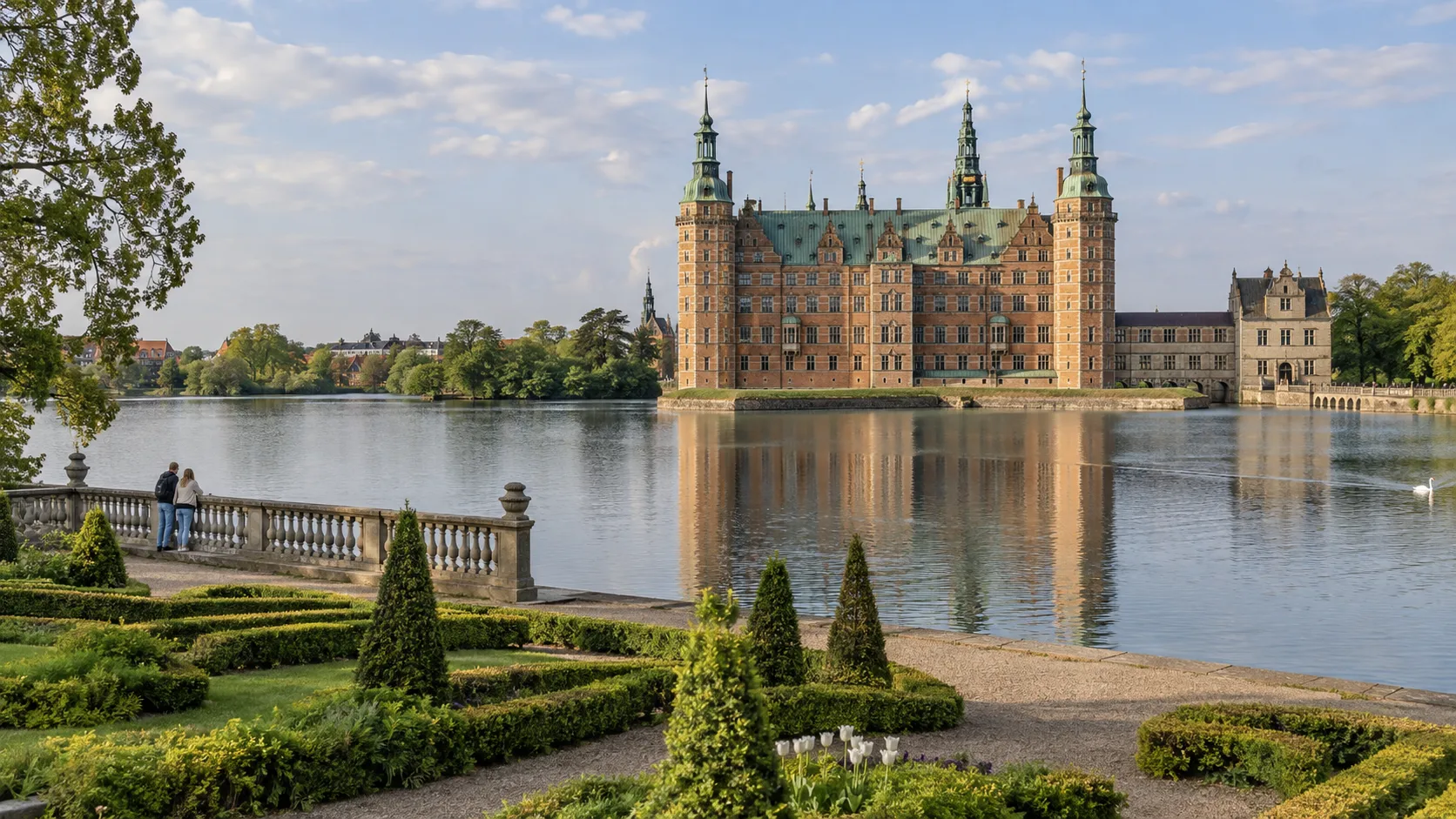 Frederiksborg Castle reflected in its lake in Denmark