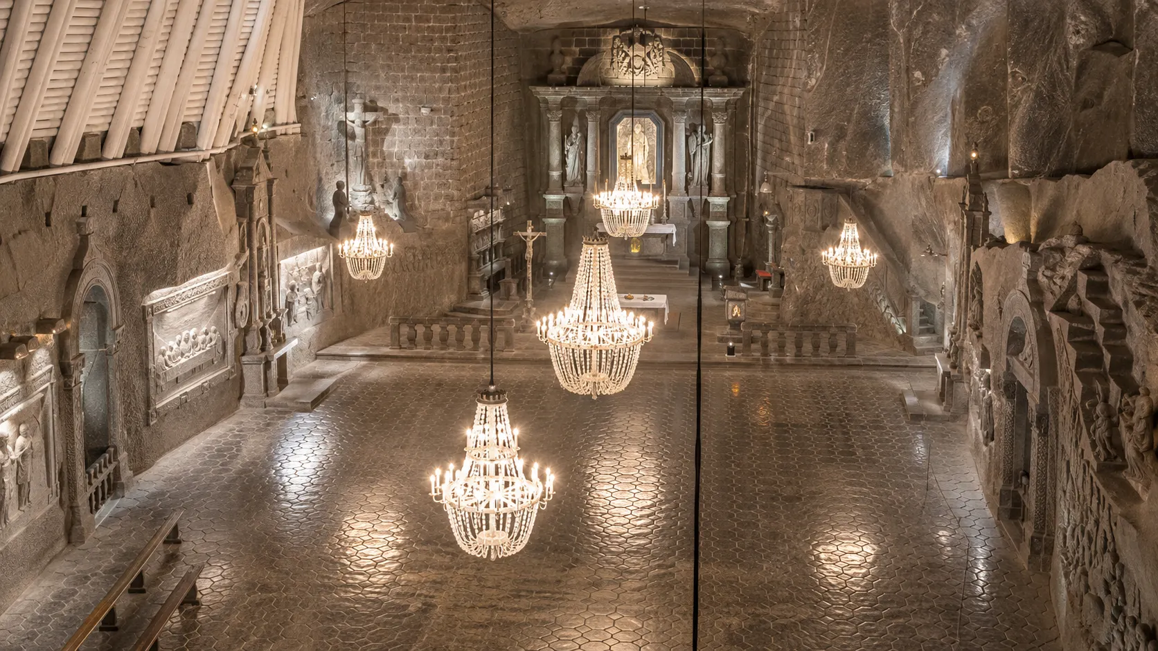 Salt-carved chandeliers and reliefs inside Wieliczka's Chapel of St Kinga