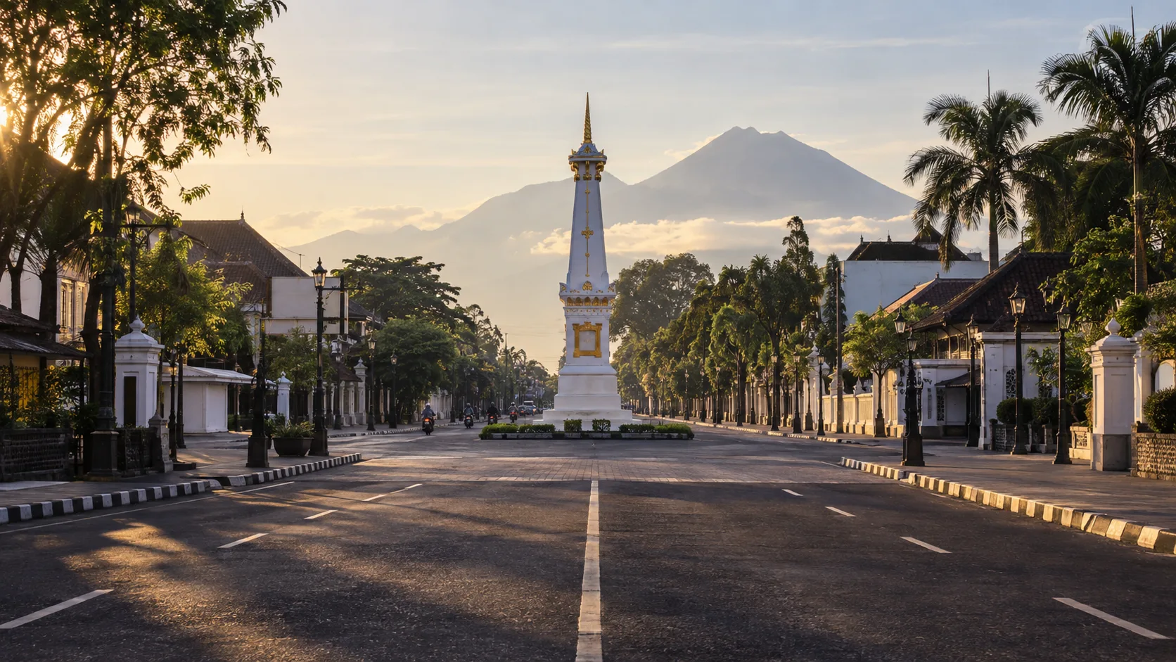 Yogyakarta's white Tugu monument aligns with a quiet ceremonial avenue and Mount Merapi at sunrise.